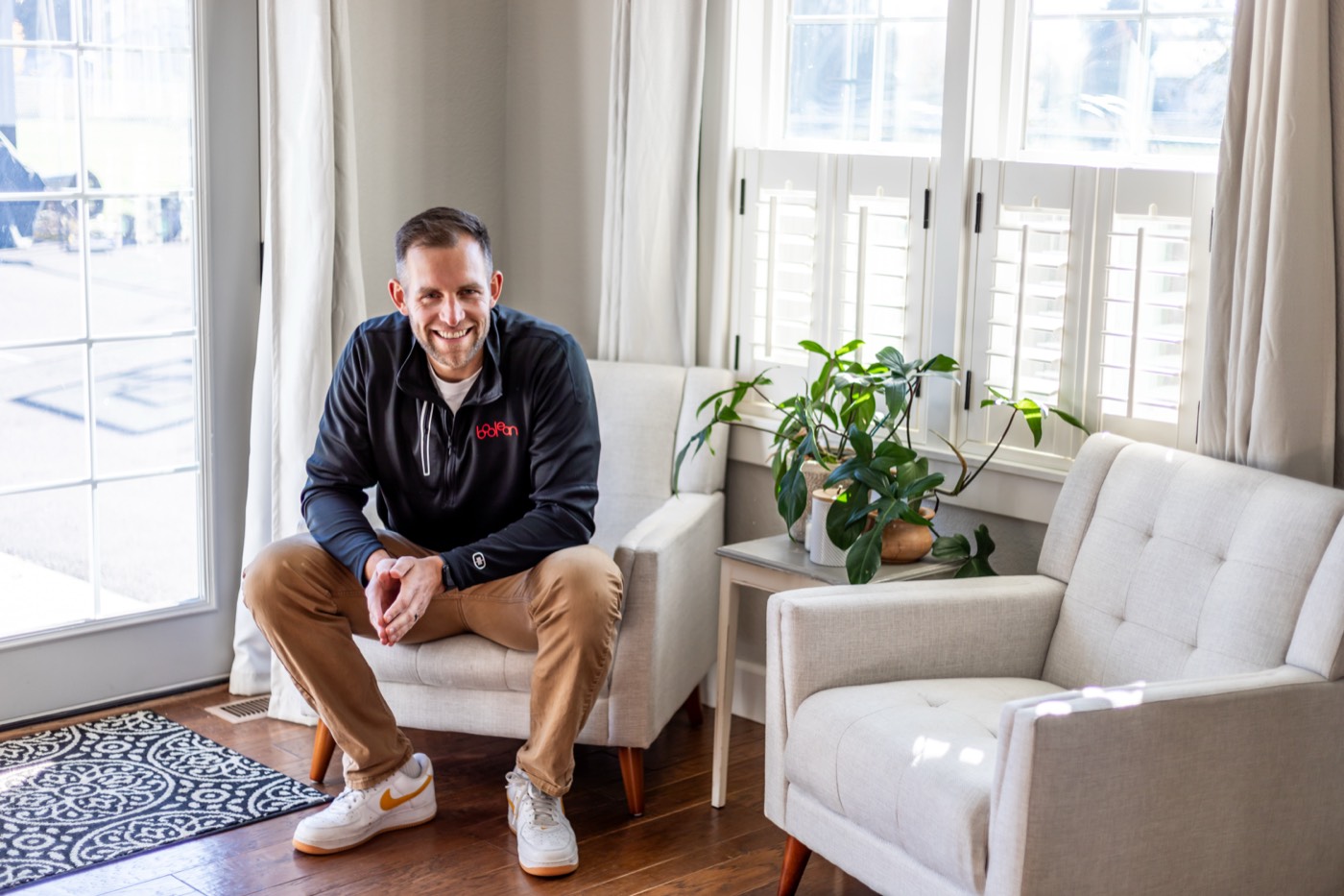 Chris Kiefer relaxed in a sunlit living room
